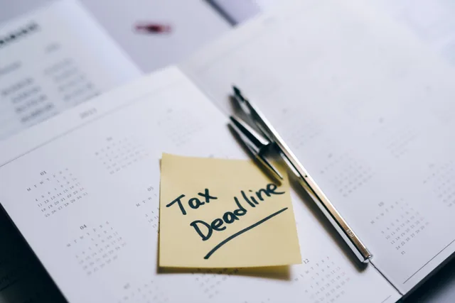 A close-up of a calendar with a sticky note reminding about the tax deadline. Best subtract business days tools 2027: facts and context, explained properly
